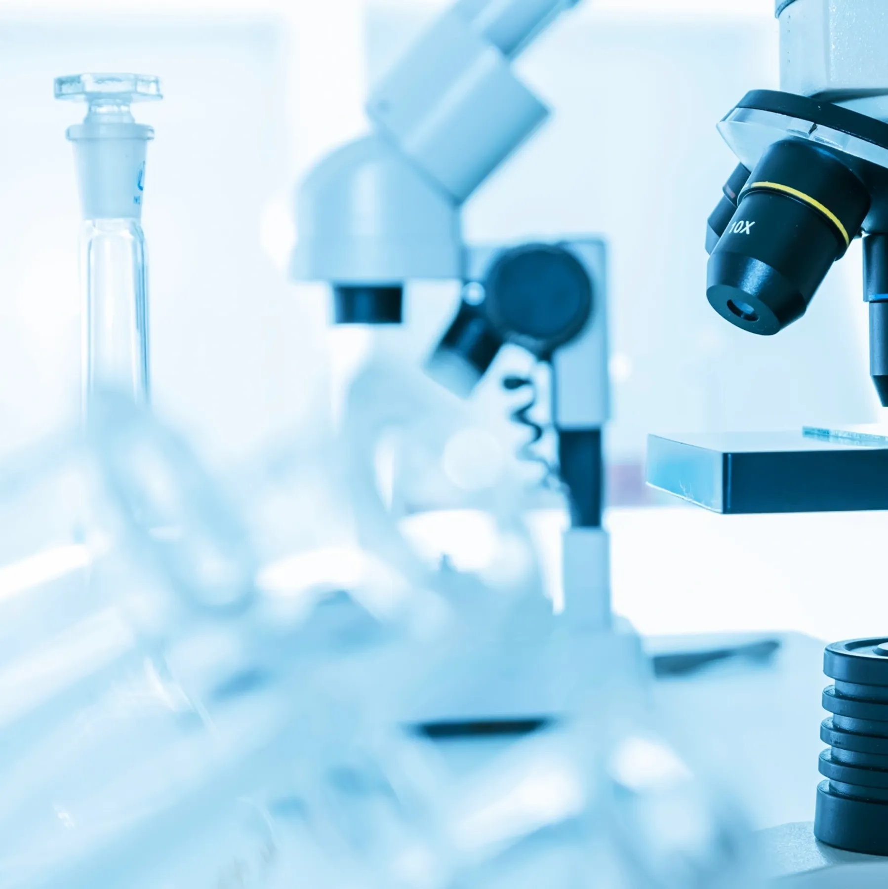 Microscope and laboratory flasks representing peptide core values